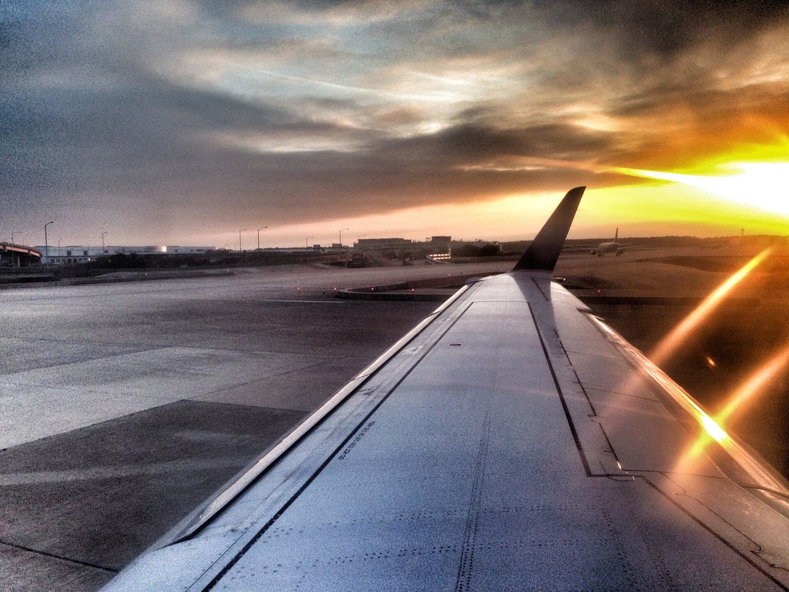 Aircraft wing at sunset